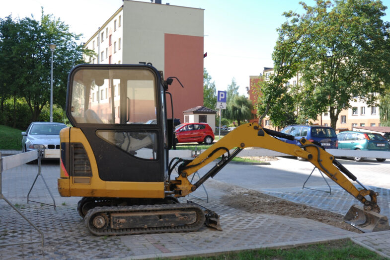 Excavator,At,The,Construction,Site,Of,A,Parking,Lot,For